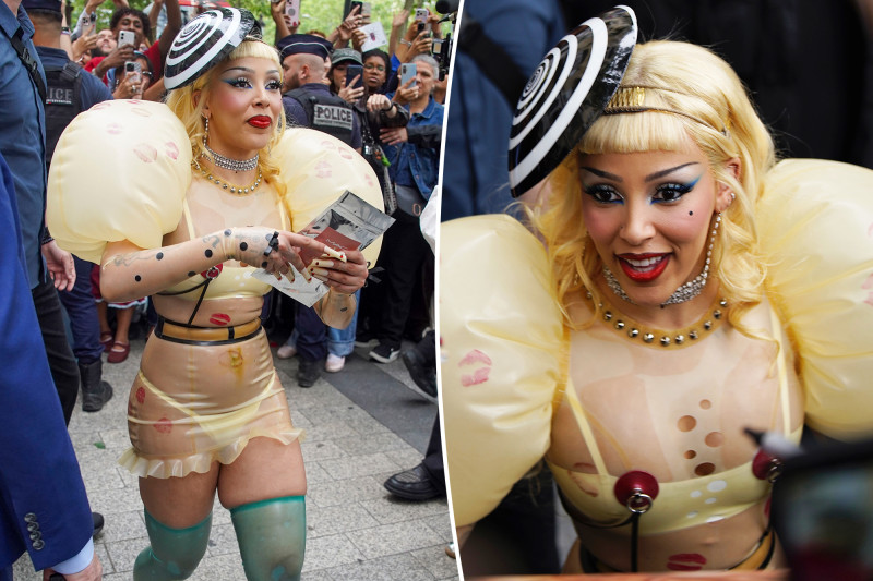 Doja Cat's Latex Madness: Faux Piercings, Inflated Sleeves, and Lipstick Kisses Galore